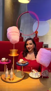 A promotional reel for the Charlie and the Chocolate Factory themed afternoon tea at One Aldwych Hotel, featuring close-ups of themed pastries, cocktails, candy floss, and a hot chocolate cart.