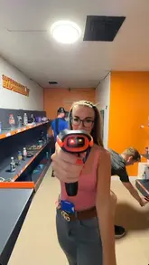 A promotional video for Challenge Point Liverpool, featuring a group of friends participating in various competitive games including laser challenges, quizzes, and memory tests. The video highlights the interactive and team-based nature of the venue, showcasing the different game rooms and the competitive atmosphere.