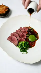 A chef explains the philosophy and process behind the dishes at Myrtle Restaurant, highlighting the importance of produce, training, and execution in creating a delightful dining experience.