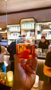 A montage video showcasing a 'Negroni Sessions' event at Equal Parts bar, featuring DJ music, cocktail preparation, and the bar's atmosphere.