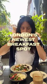 A short, upbeat video showcasing a visit to 'No Forty Nine' in St John's Wood, London. The creator highlights the cafe's breakfast and brunch offerings, including pastries and plated dishes, while showing the interior and outdoor terrace seating.