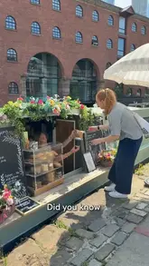 A creator-led vlog showcasing a walk through the Castlefield area of Manchester, highlighting a floating coffee boat and a waterside restaurant called The Wharf.
