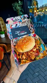 A vibrant, fast-paced reel showcasing a visit to Platform Street Food in Cardiff Bay. The creator highlights various dishes from different independent vendors, including burgers, pasta, sandwiches, and desserts, while capturing the casual, social atmosphere of the venue.
