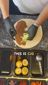 A short, informative video explaining the history and preparation of Cig Kofte at Komagene in London. The creator walks the viewer through the assembly of the wrap while explaining the transition from raw meat to the current vegetarian bulgur-based version.