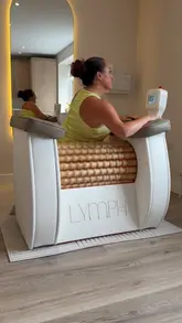 A personal vlog-style review of a lymphatic drainage studio, showing the user's experience with the machine and the facility.