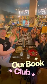 A vlog-style reel documenting a book club outing that includes a meal at Zizzi, a visit to a food festival for sweet treats, and a trip to Waterstones to select the next book.
