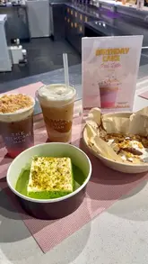 A short, fast-paced promotional video showcasing the menu at The MilkCake Man stall in Selfridges, featuring their birthday iced latte, cookie dough, matcha drinks, and milk cakes.