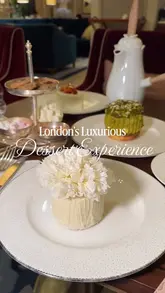 A high-quality, slow-motion showcase of a luxury dessert experience at the Jumeirah Carlton Tower, featuring close-ups of intricate patisserie, tableside service of crème caramel, and the pouring of rich hot chocolate.