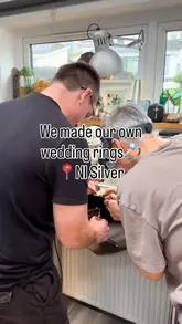 A montage video showing a couple participating in a jewelry-making workshop to create their own wedding rings. The video captures various stages of the process, including filing, hammering, and soldering, set to music with text overlays explaining the activity.