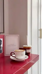 A short, aesthetic montage showcasing the interior and drink offerings of 73 HOURS, a coffee and smoothie bar located within a hair salon in Chelsea. The video features slow, deliberate shots of the counter, the branding, and the drinks.