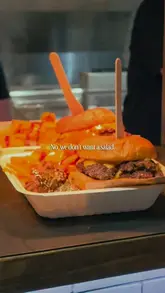 A short montage showcasing various burger, loaded fry, and chicken wing dishes at Big Buns, set to music with text overlays.
