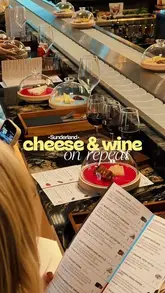 A promotional video for Black's Corner at Culture House in Sunderland, showcasing their unique cheese and charcuterie conveyor belt experience, wine selection, and stylish interior design.