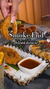 A promotional reel for Smoke End, a steakhouse in London, showcasing their interior decor and a variety of dishes including steaks, burgers, seafood, and mocktails.