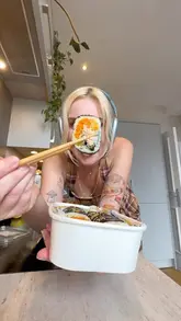 The creator showcases a large takeaway order from a Korean street food venue, highlighting various dishes like corn dogs, kimbap, tteokbokki, and fried chicken. The video follows the process from ordering to eating at home, maintaining a high-energy, casual vlog style.