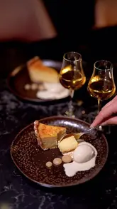 A high-quality promotional video showcasing a tasting menu at Romy Gill at The Pem restaurant and an overnight stay at the Conrad London St. James hotel.