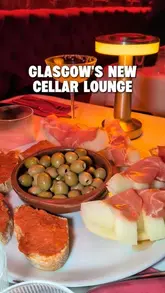A promotional video showcasing the opening of 'La Bodega', a cellar lounge in Glasgow. The video features a montage of Spanish tapas, cocktails, live music, and a lively atmosphere with people dancing.