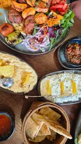 A family-focused review of Olive Lounge in Beverley, showcasing the restaurant's interior, the open charcoal grill, a variety of Turkish dishes including kebabs and desserts, and the overall dining experience.