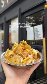 A vibrant food review reel showcasing the new 'Food I Grew Up Eating' brunch menu at Ashoka in Sheffield. The video features close-up shots of various dishes like chicken keema muffins, idli, and chaat, highlighting the textures and ingredients. It captures the restaurant's interior and the creator enjoying the food, effectively promoting the brunch experience.