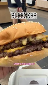 A short, handheld review of a Bleecker Burger visit, showcasing the branding, packaging, and the food items including a double cheeseburger, fries with sauce, and an Oreo milkshake.