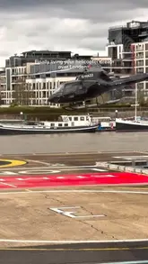 A short, engaging video capturing a helicopter tour over London, featuring aerial views of iconic landmarks like Big Ben, Tower Bridge, and The Shard, with the creator sharing the experience from inside the cockpit.