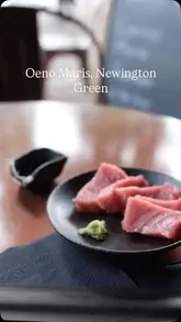 A short, handheld reel showcasing Oeno Maris, a fishmonger in Newington Green, highlighting their fresh sashimi selection and shop offerings.