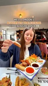 A couple visits Pailin Thai Cuisine, a restaurant located inside The Rising Sun pub in West London. The video features a tour of the space, a look at the menu, and a detailed showcase of various Thai dishes including starters, mains, and dessert.