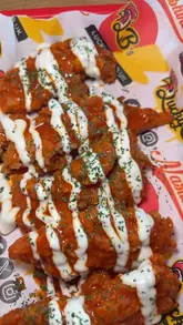 A review of Lucky B's in Glasgow, featuring a variety of their fried chicken dishes, including tenders, a burger, a salad, mozzarella sticks, and milkshakes.