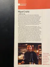 A photograph of a magazine page featuring an interview with Miguel Cruina regarding the Spanish wine industry, including his thoughts on various regions and the market perception of Spanish wines.