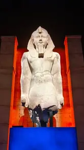 A promotional video showcasing the 'Ramses and the Pharaohs' Gold' exhibition at NEON, Battersea Power Station, featuring a variety of ancient Egyptian artifacts including statues, jewelry, and the sarcophagus of Ramses II.