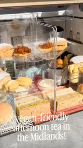 A creative showcase of a themed afternoon tea experience at the Black Country Living Museum, featuring a miniature shop replica presentation and highlighting vegan and gluten-free menu options.