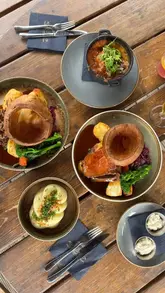 A montage video showcasing a Sunday visit to Dunston Hall, featuring a Sunday roast at the bistro, a tour of the food hall and deli, and a walk through the garden centre.