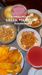 A short, fast-paced montage showcasing a variety of Greek dishes, including dips, fresh bread, crisps, tomato salad, and tuna ceviche, at a Michelin-starred restaurant in London.