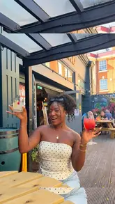 A promotional video featuring a creator visiting a pub for a bottomless brunch, highlighting the availability of the offer every day of the week and showcasing new limited-edition Malibu cocktails alongside a full English breakfast and a burger.