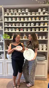 A vlog-style reel documenting a visit to a pottery cafe in Battersea, showing the process of selecting and painting pottery, accompanied by drinks and cake.