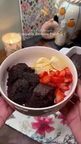 A short recipe video demonstrating how to make a scoopable brownie pudding, featuring steps from mixing ingredients to baking and serving with ice cream and strawberries.
