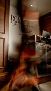 A recap video of a launch event for 'Romy Gill at The Pem', featuring guests, canapés, henna art, and traditional dancers.