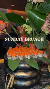 A vibrant vlog-style video showcasing a new Sunday brunch experience at Cielo at Los Mochis, featuring unlimited sushi, tacos, desserts, live music, and a fashion trunk show on a rooftop.