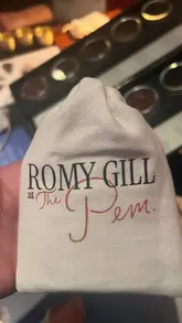 A montage video capturing an event at 'Romy Gill at The Pem,' featuring shots of the venue, guests, live music, and the preparation and serving of Indian-inspired dishes.
