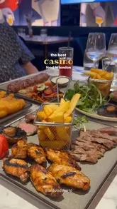 A promotional montage showcasing the food, drinks, and interior of Ember at Horizons, a restaurant located within a casino in London. The video highlights various dishes, cocktails, and the venue's atmosphere.