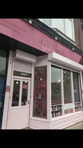 A short promotional video for Patisserie Gabriella, featuring a tour of the shop exterior and interior, a display of individual cakes, and a demonstration of the packaging process.