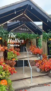 A montage-style tour of The Hollies Farm Shop, highlighting its seasonal autumn and Halloween decor, gift shop, bakery, deli, and butcher counter. The video uses quick cuts to showcase the variety of products and the inviting atmosphere of the venue.