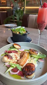 A short, polished review of Ardnamurchan restaurant in Glasgow, showcasing a variety of dishes including scallops with pork belly, venison steak, Sunday roast, and desserts like sticky toffee pudding and brownies. The video uses close-up shots of the food to entice viewers, positioning the venue as an ideal spot for pre-theatre dining.