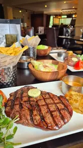A promotional video showcasing the refurbished interior and food offerings at a Miller & Carter steakhouse.