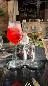 A montage of various spritz cocktails being held and enjoyed in different outdoor and indoor settings, set to music with a text overlay counting down the end of 'Spritz Season'.
