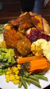A vlog-style review of a carvery at The New Wellington in Brierley Hill, showcasing the food selection, the plated meal, the outdoor play area, and the dessert display.