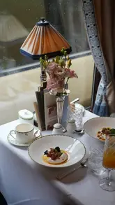 A cinematic showcase of a luxury train journey on the Belmond British Pullman, featuring fine dining, scenic views, and elegant interiors.