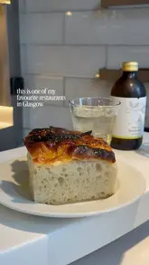 A short, visually focused reel showcasing the menu and dishes at Crabshakk in Glasgow. The video features close-up shots of various seafood plates, including a stuffed crab shell, a white fish dish, and a dessert, interspersed with shots of the menu and the restaurant's exterior.