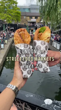 Close-up of a Sunday roast burrito with beef, potatoes, and veggies at Camden Market, London street food scene.