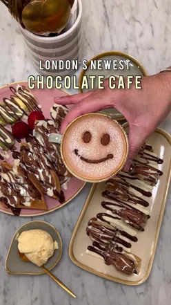 Delicious hot chocolate and waffles at London's new chocolate cafe in Soho, perfect for dessert lovers and foodies.