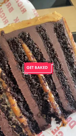 Decadent chocolate caramel cake from GET BAKEDยฎ in Leeds, a must-try for dessert lovers.